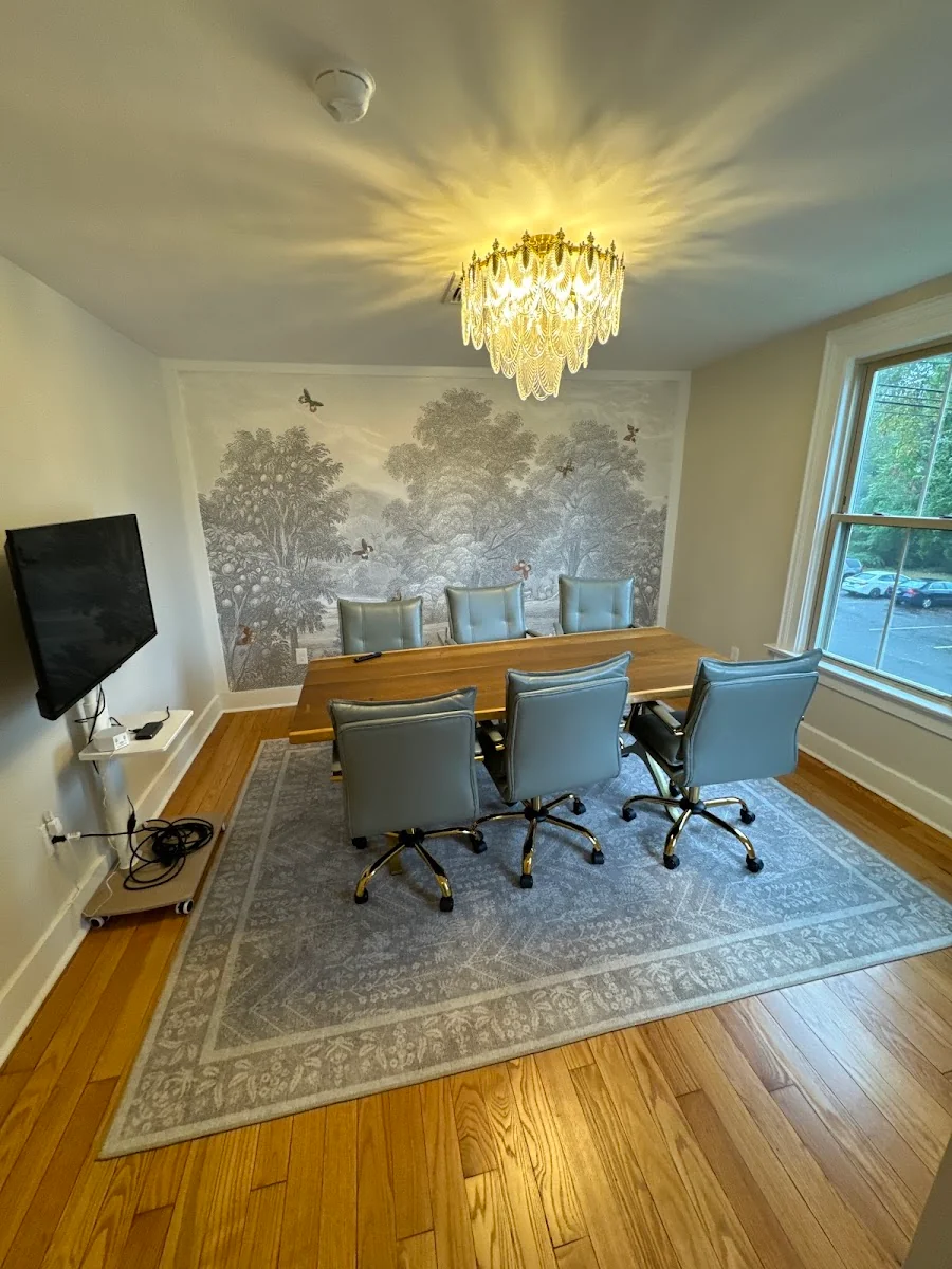 Muse Coworking Collective - elegant Victorian conference room with crystal chandelier and toile wallpaper
