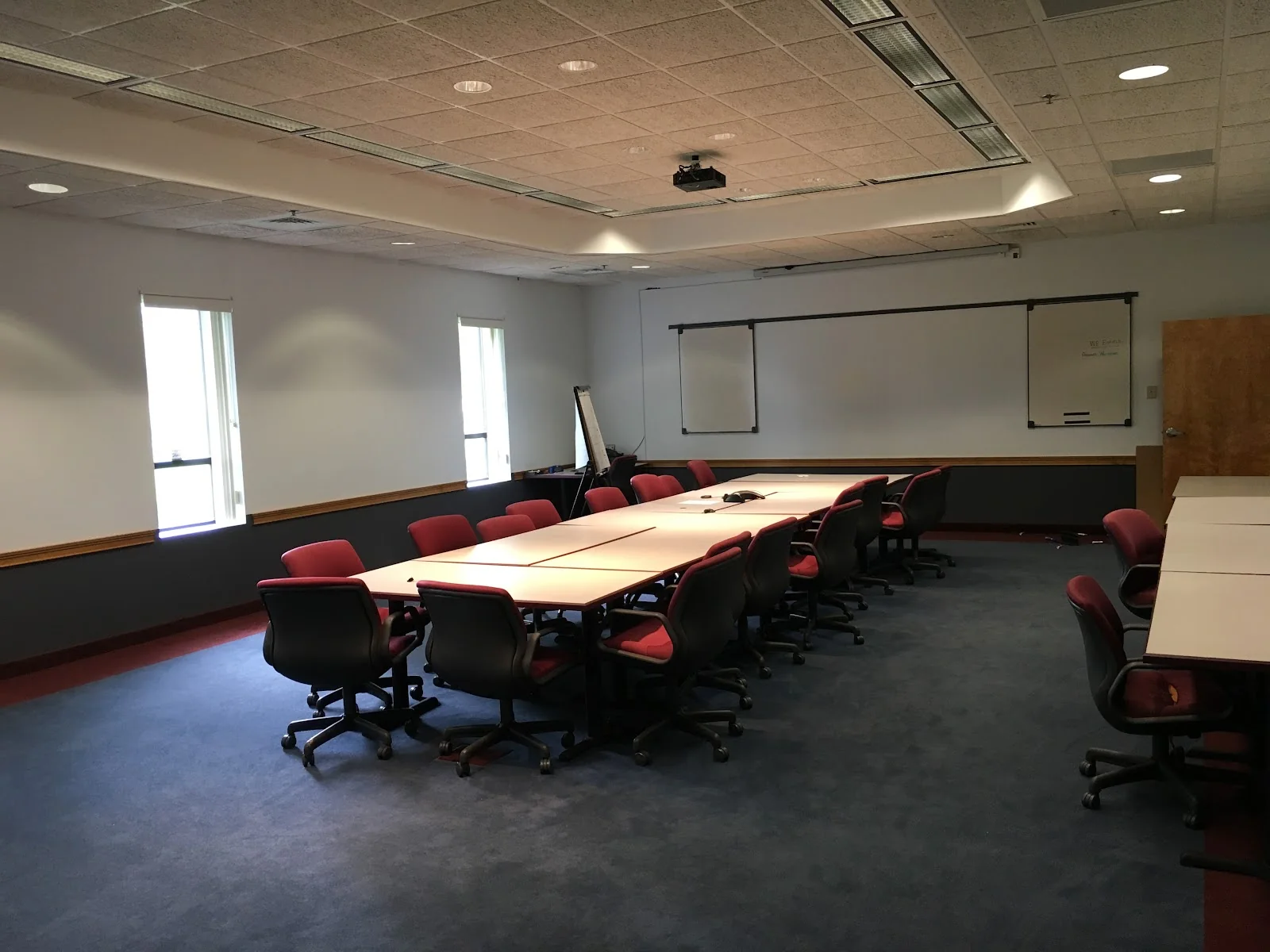 Enfield Office Suites - large conference room with burgundy chairs and whiteboards